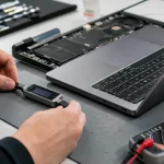 Technician checking a laptop USB-C charging connection with a power meter